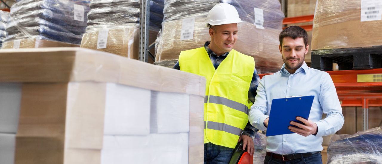 photo of two men looking at a card in a 3pl warehousing